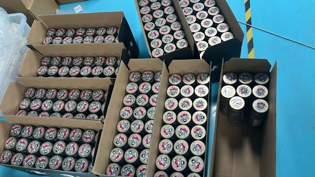 Cases of cans laid out on the packing floor